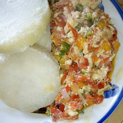 A picture of Boiled yam with vegetable and scrmambled egg sauce.