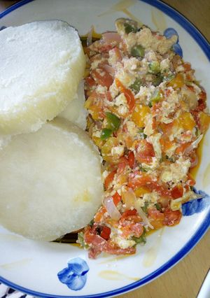 A picture of Boiled yam with vegetable and scrmambled egg sauce.