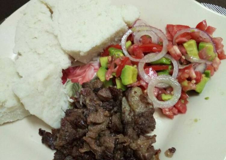 Dry fry beef with kachumbari and ugali