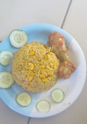 A picture of Jollof rice and chicken stew.