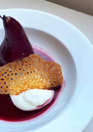 A picture of Elderberry and thyme poached pear.