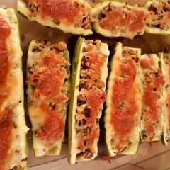 A picture of Minced chicken pesto marrow boat.