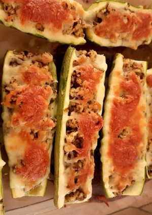A picture of Minced chicken pesto marrow boat.