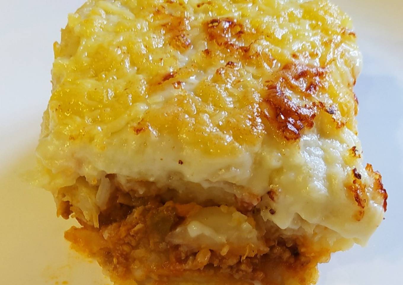 Trinxat con boloñesa y bechamel gratinado