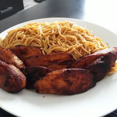 A picture of Spagetti with fried plantain.