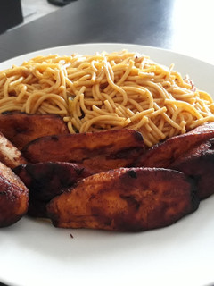 A picture of Spagetti with fried plantain.