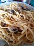 Spaghetti con champignones y crema