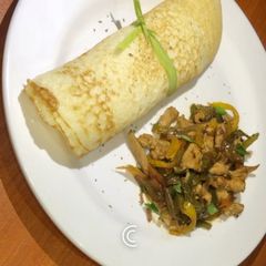 A picture of Sinasir and chicken stir fry.