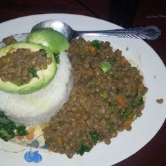 A picture of Rice with lentils and spinach.
