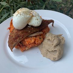 A picture of Smoked PiriPiri mackerel with tomato couscous and hummus.