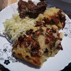 A picture of Bacon and cheese mashed potato bake #potatodish.