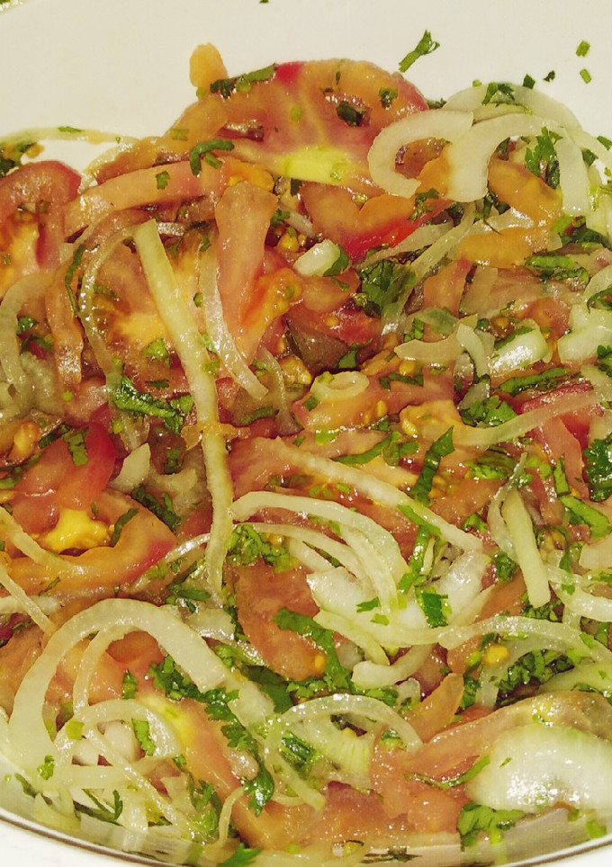 Una foto de Ensalada de Tomates con Cebolla
