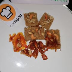 A picture of Sooji ka halwa with caramelised nuts.