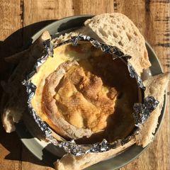 A picture of Delicious melting Mont d’or cheese 🧀.