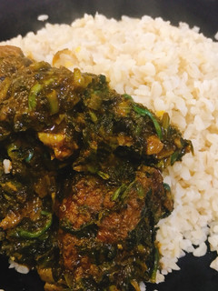 A picture of Vegetable soup and local rice.