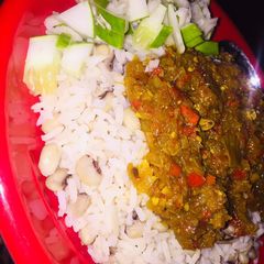 A picture of Rice n beans wit onion sauce.