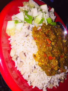 A picture of Rice n beans wit onion sauce.