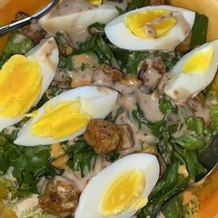 A picture of Chicken Caesar-Style Salad with Boiled Eggs.
