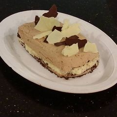 A picture of Orange Milk Chocolate and White Chocolate Mousse Torte.