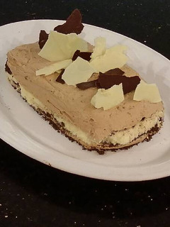 A picture of Orange Milk Chocolate and White Chocolate Mousse Torte.