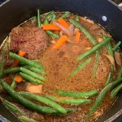 A picture of Hamburger Steak with Mushrooms, Green Beans & Carrots.