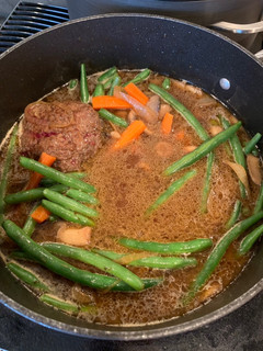 A picture of Hamburger Steak with Mushrooms, Green Beans & Carrots.