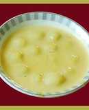 Delicious rice dumplings in milk sweetened with sugar (Paal kozhukattai in Tamil)