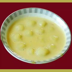 Delicious rice dumplings in milk sweetened with sugar (Paal kozhukattai in Tamil) A picture of Delicious rice dumplings in milk sweetened with sugar (Paal kozhukattai in Tamil).