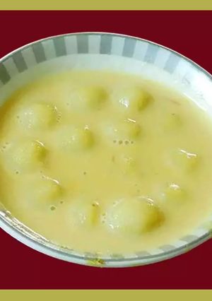 A picture of Delicious rice dumplings in milk sweetened with sugar (Paal kozhukattai in Tamil).