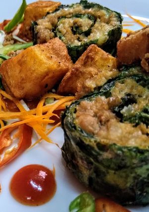 A picture of Baked Spinach chicken cheese roll.