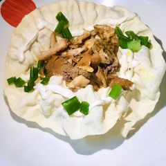 A picture of Microwave papad bowl with chicken.