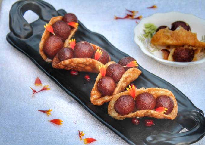 Warm gulab jamun in sweet crunchy tacos Recipe