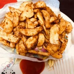 A picture of Potato wedges.