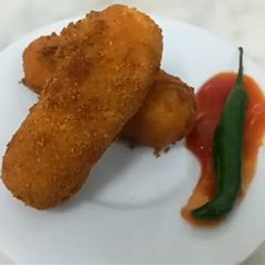 A picture of Chicken Mozerella Sticks.