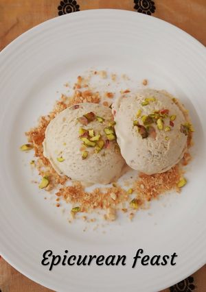 A picture of No machine Fig and Cinnamon Ice-cream garnished with cookies.