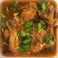 A picture of Curd Chicken in Cooker.