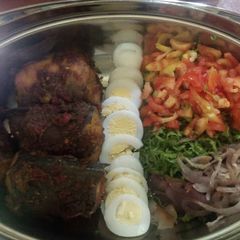 A picture of Salad with fish & egg.