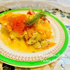 A picture of Hake in the oven under a cheese crust.
