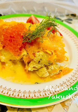 A picture of Hake in the oven under a cheese crust.