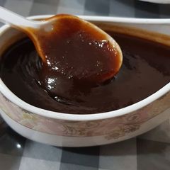 A picture of Imli chutney or tamarind chutney.