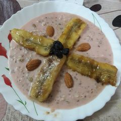 A picture of #name contest#caramelized banana in a pool of rabri#cookpadindiacommunity.