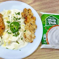 A picture of Potato egg salad with chicken fillet.