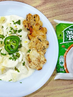 A picture of Potato egg salad with chicken fillet.