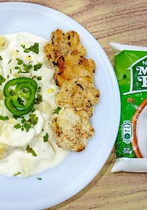 A picture of Potato egg salad with chicken fillet.