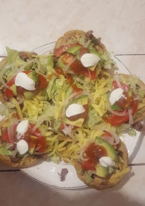 A picture of Sopes with Ground Beef.