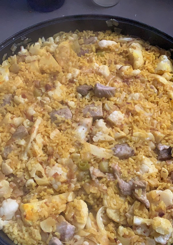 Una foto de Arroz con secreto ibérico y coliflor