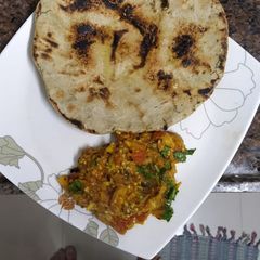 A picture of Baingan bhartha and bajara roti.