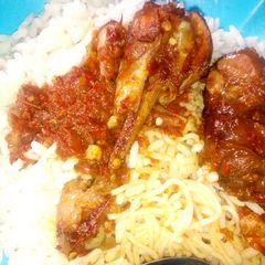 A picture of Rice,spaghetti and stew.