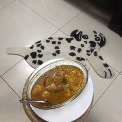 A picture of Dim Posto Bhape Steamed Egg Curry In the Khus Khus Gravy.