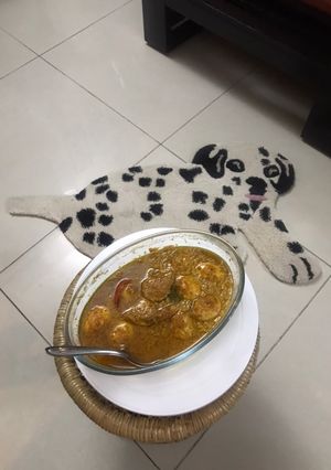 A picture of Dim Posto Bhape Steamed Egg Curry In the Khus Khus Gravy.